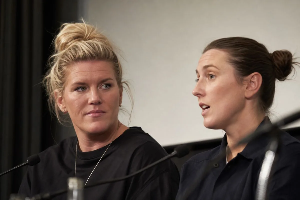 Millie Bright and Ellen White speaking at a conference panel.