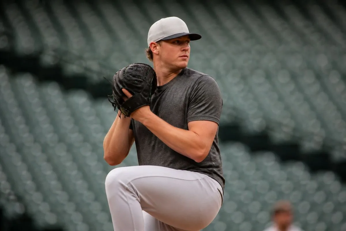 Mason Miller warming up on the pitching mound before a game.