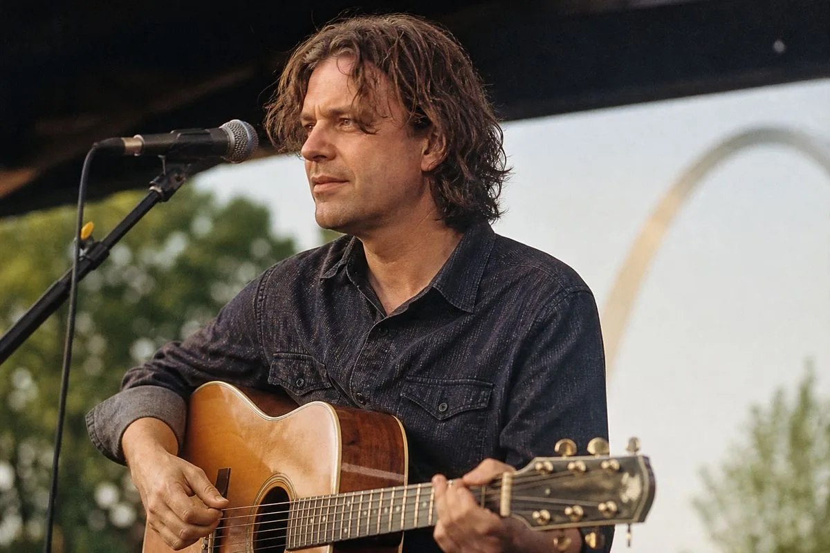David Surkamp performing on stage with a guitar in St. Louis