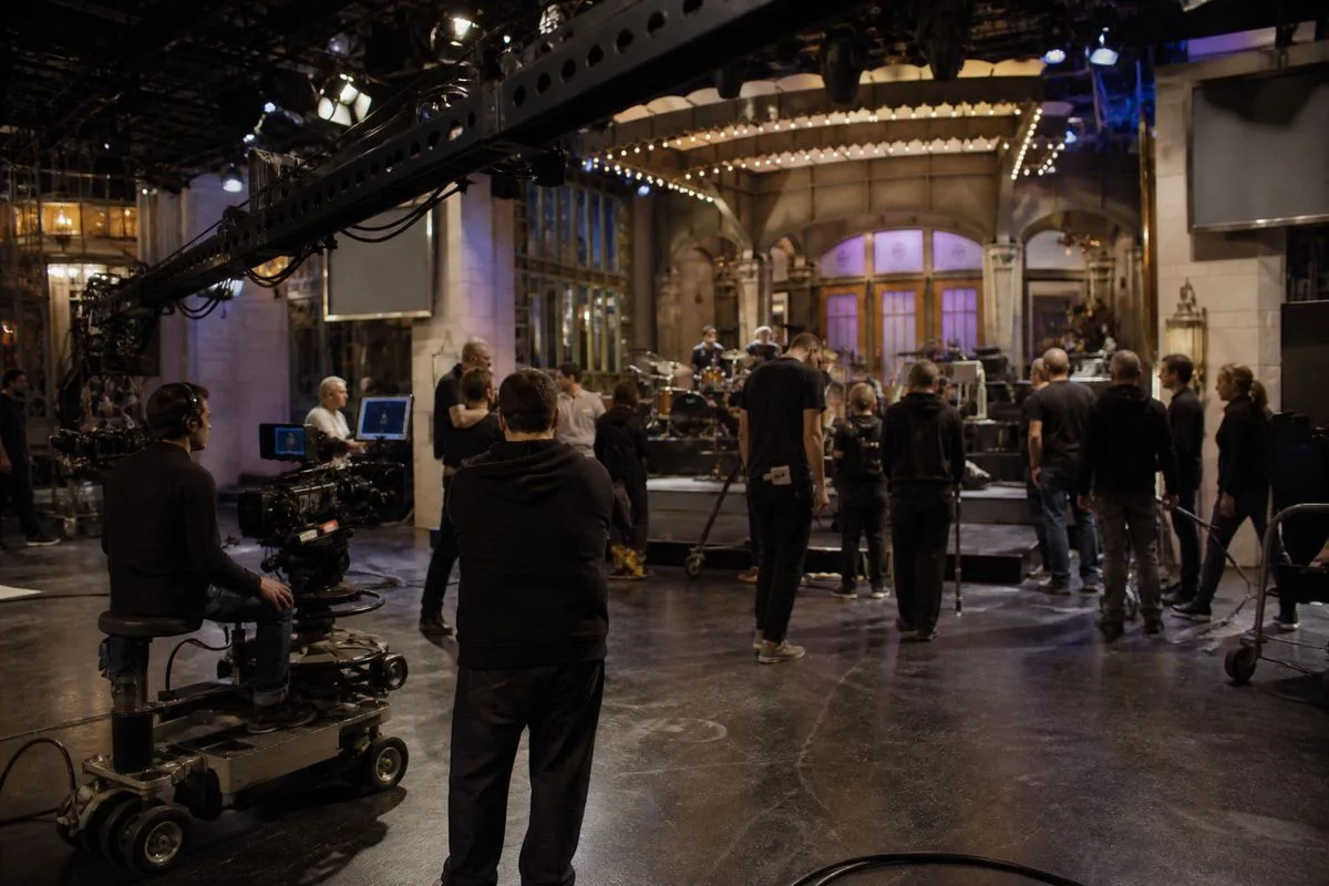 A television studio crew preparing for a live SNL UK broadcast