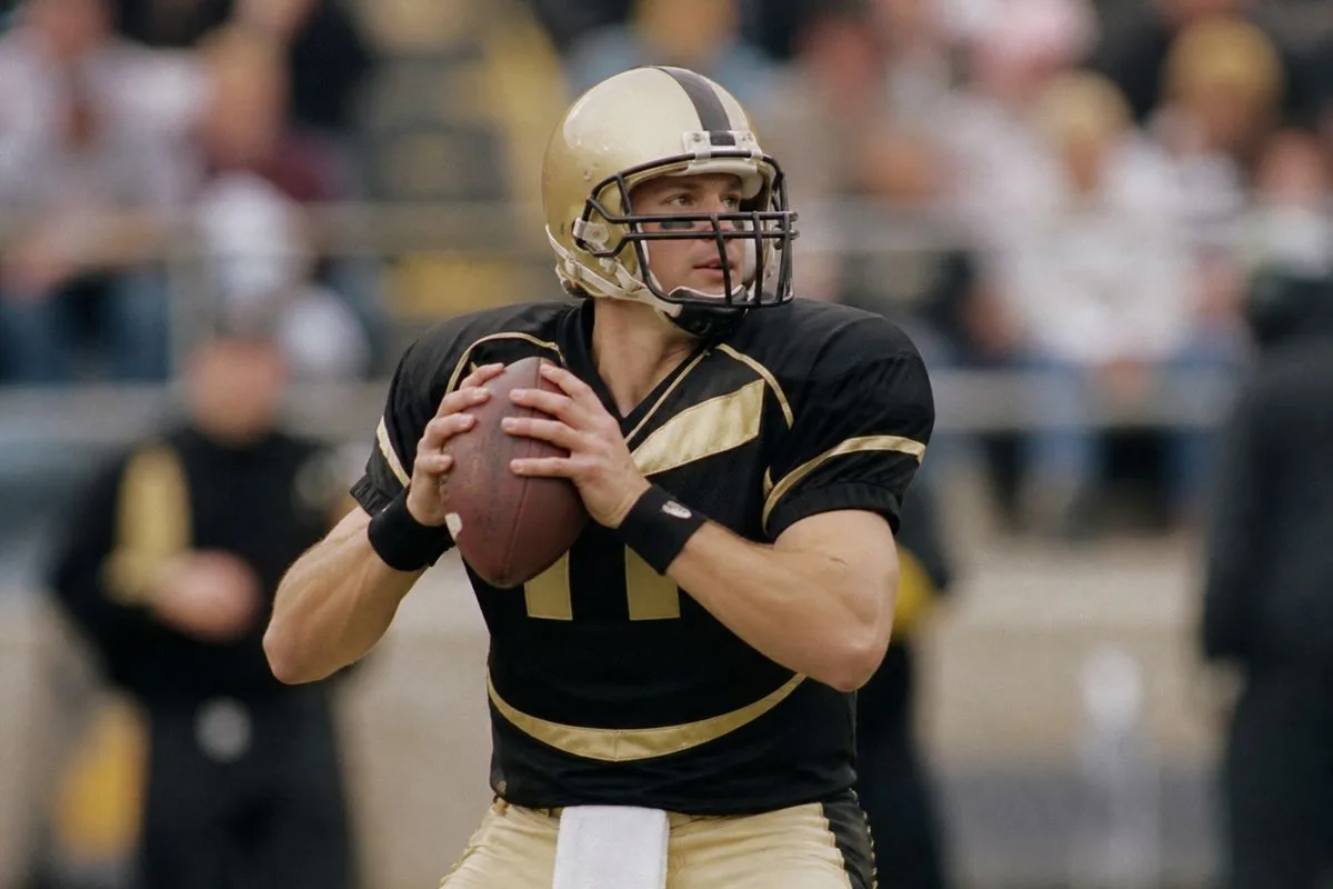 Drew Brees in Purdue football uniform during a game.