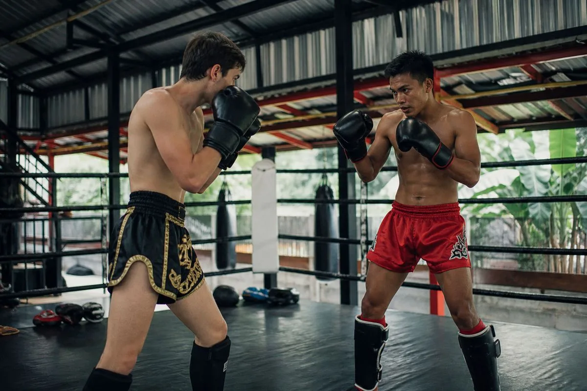 A beginner sparring in a Muay Thai gym.