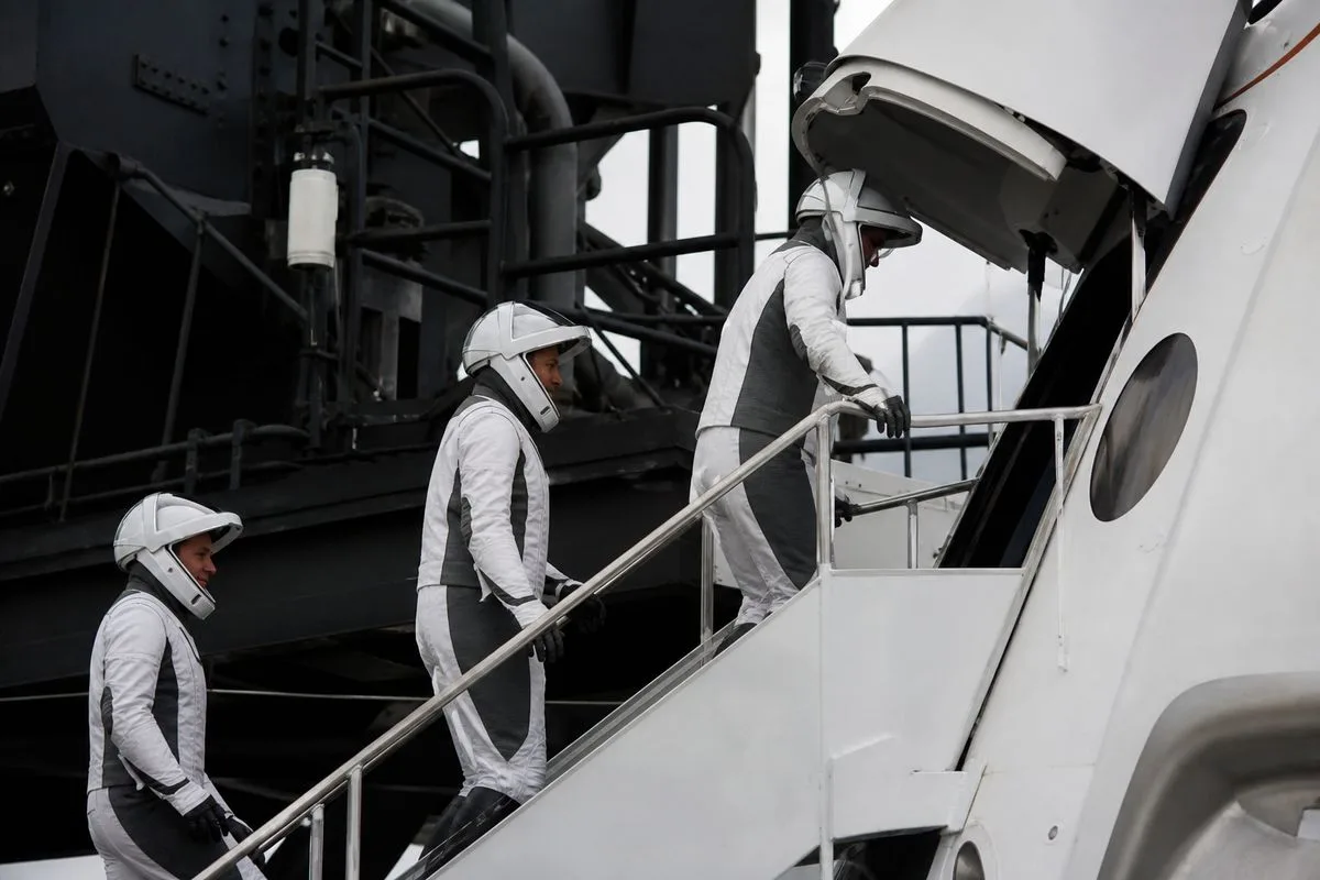 Crew-13 astronauts boarding SpaceX Crew Dragon spacecraft.