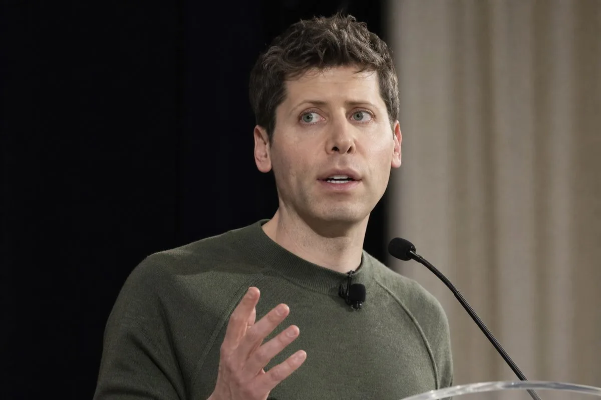 Sam Altman speaking at a tech conference podium