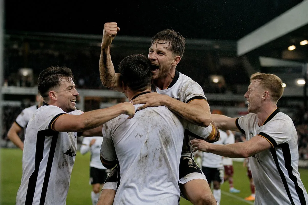 Port Vale players celebrating a late goal during EFL Trophy match