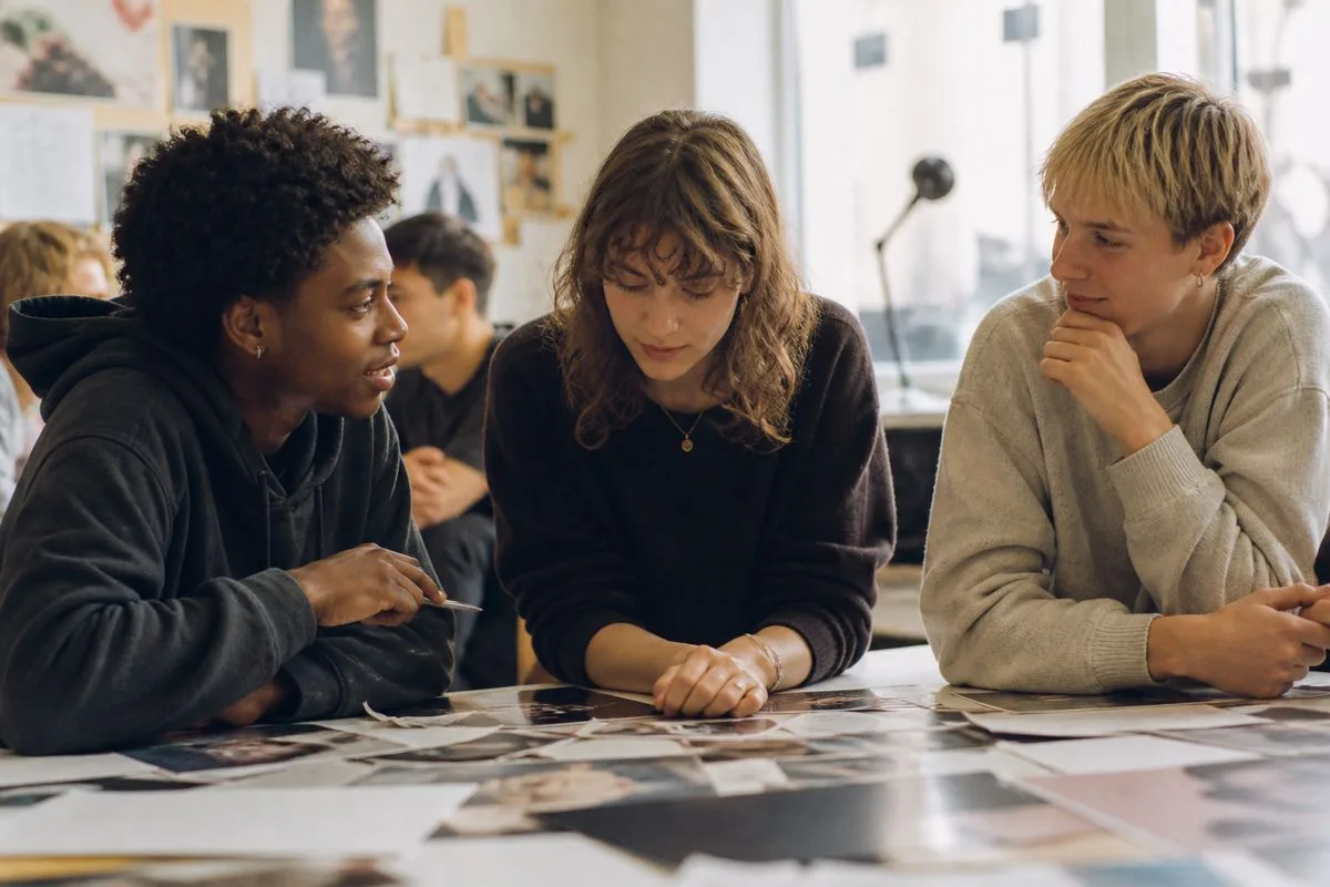 Students collaborating on a creative brainstorming session in a classroom