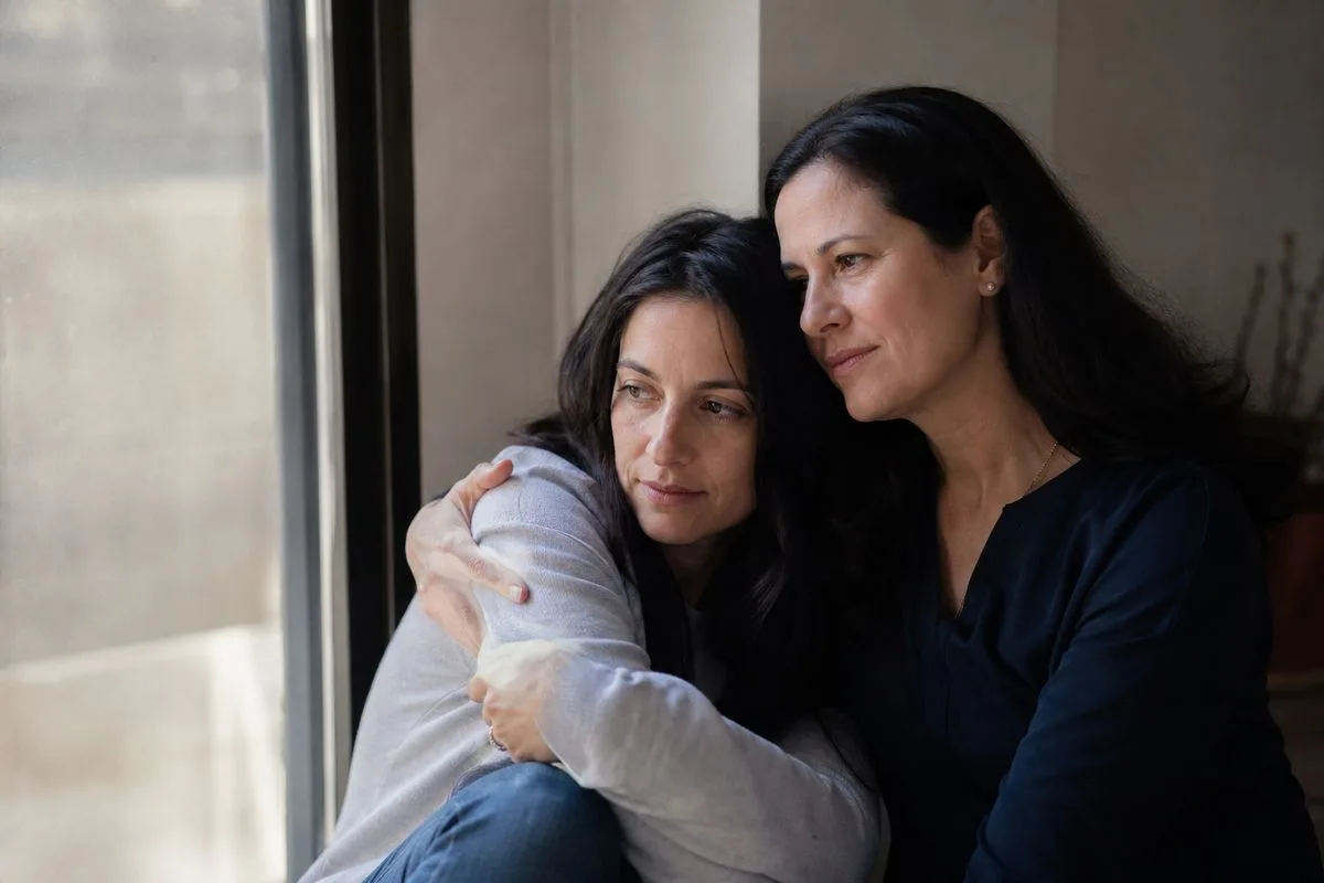 Psychologist Marisa Franco comforting her younger self in reflection