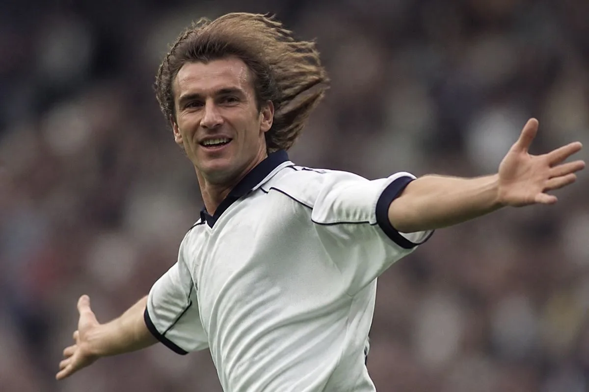 David Ginola celebrating a goal in a Tottenham jersey