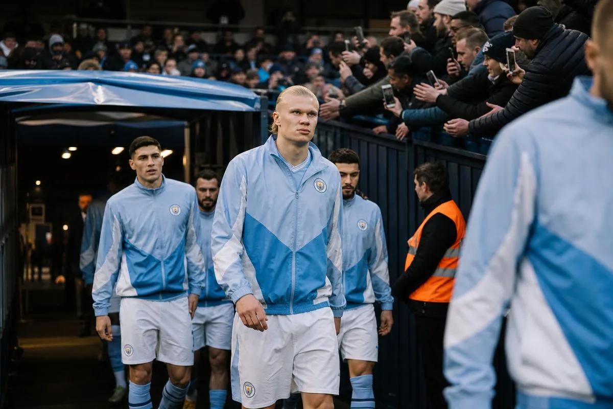 Manchester City players walking onto the pitch before a match