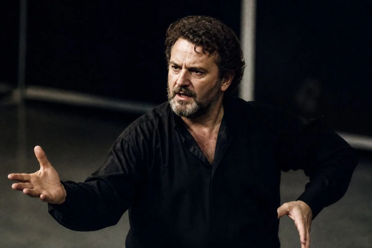 Kevin Kennedy rehearsing a villainous scene on stage in Swansea