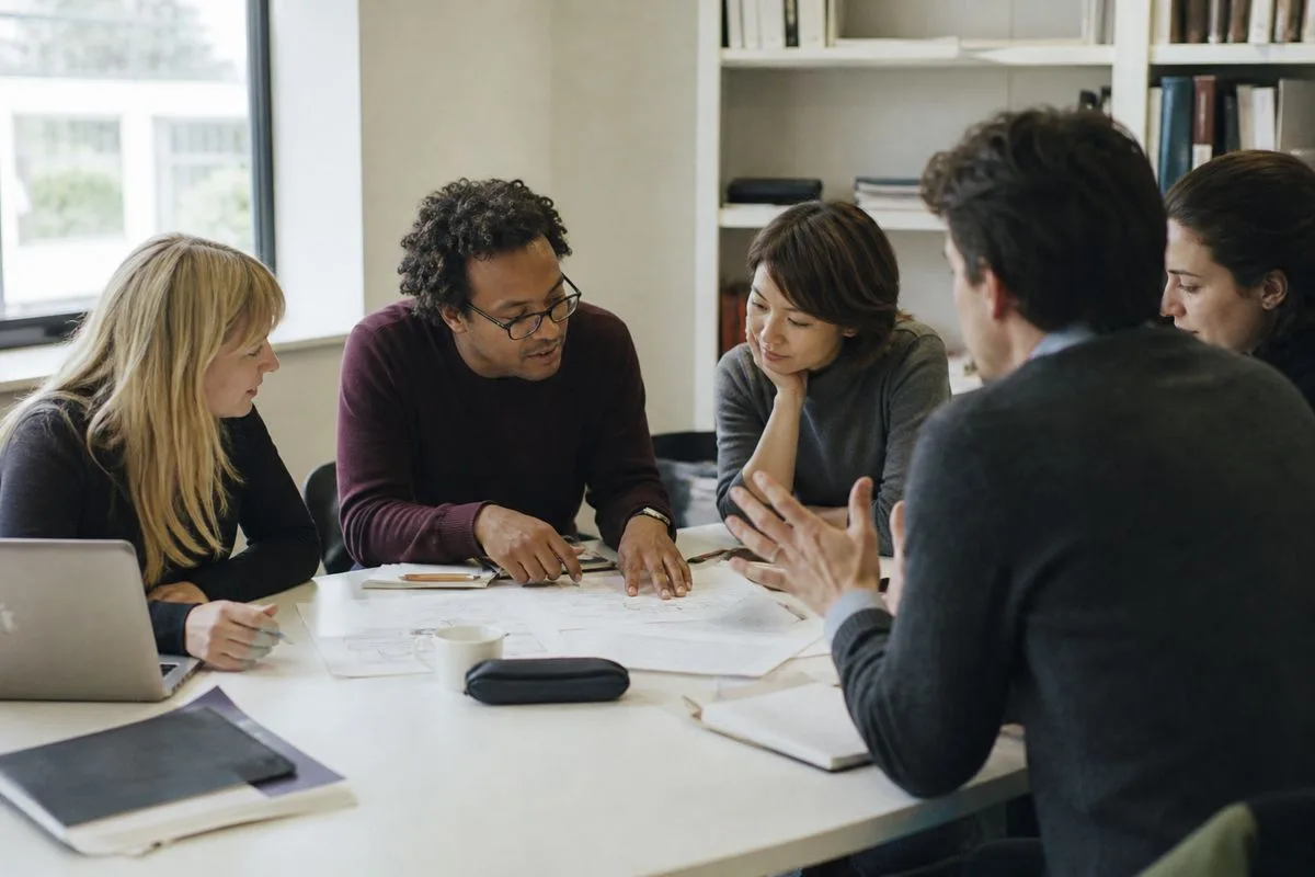 Researchers collaborating around a table at Warwick University
