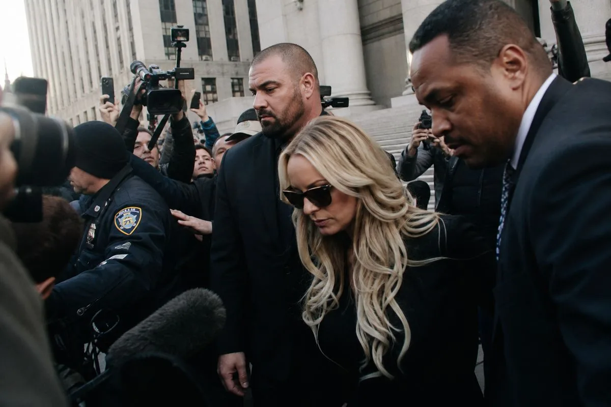 Journalists crowding around a celebrity courthouse entrance