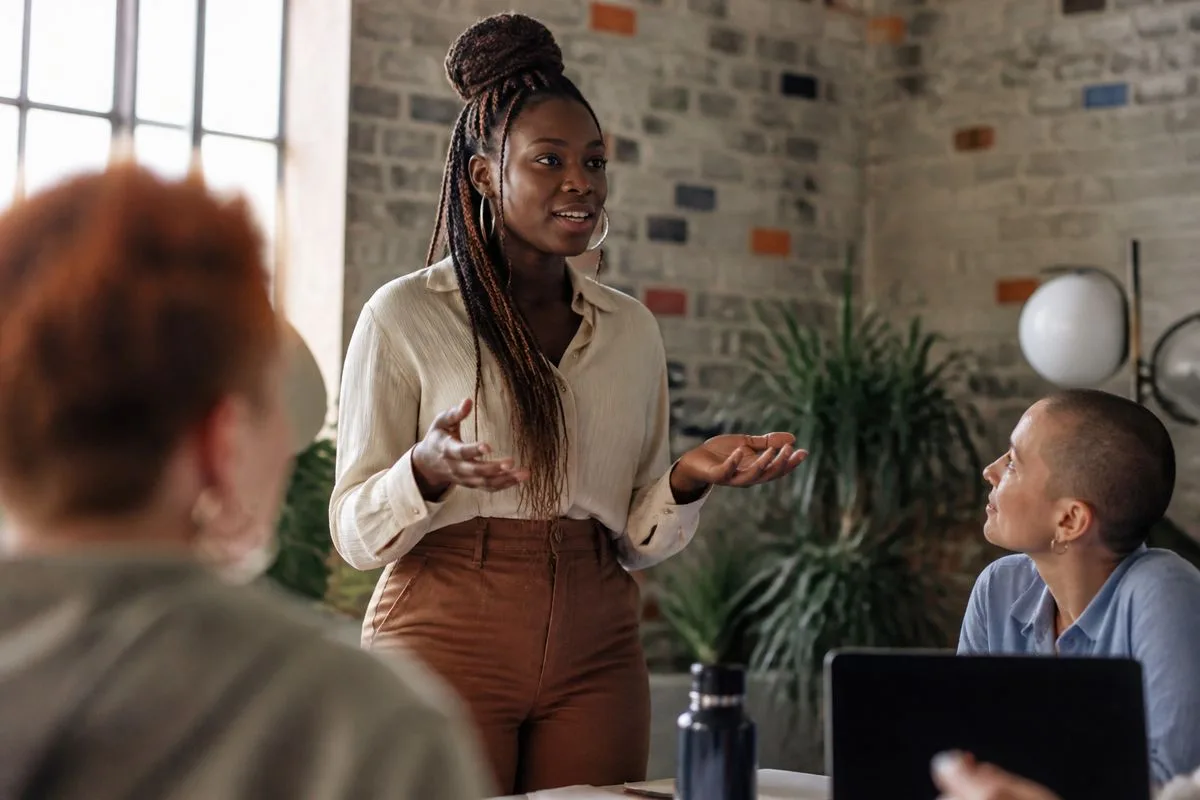 Entrepreneur pitching ideas in a vibrant coworking space