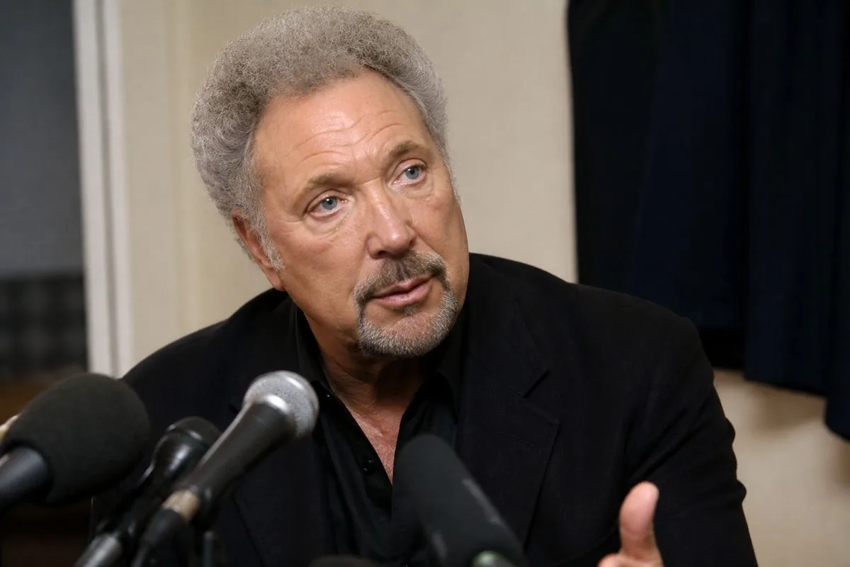 Sir Tom Jones speaking at a press conference backstage