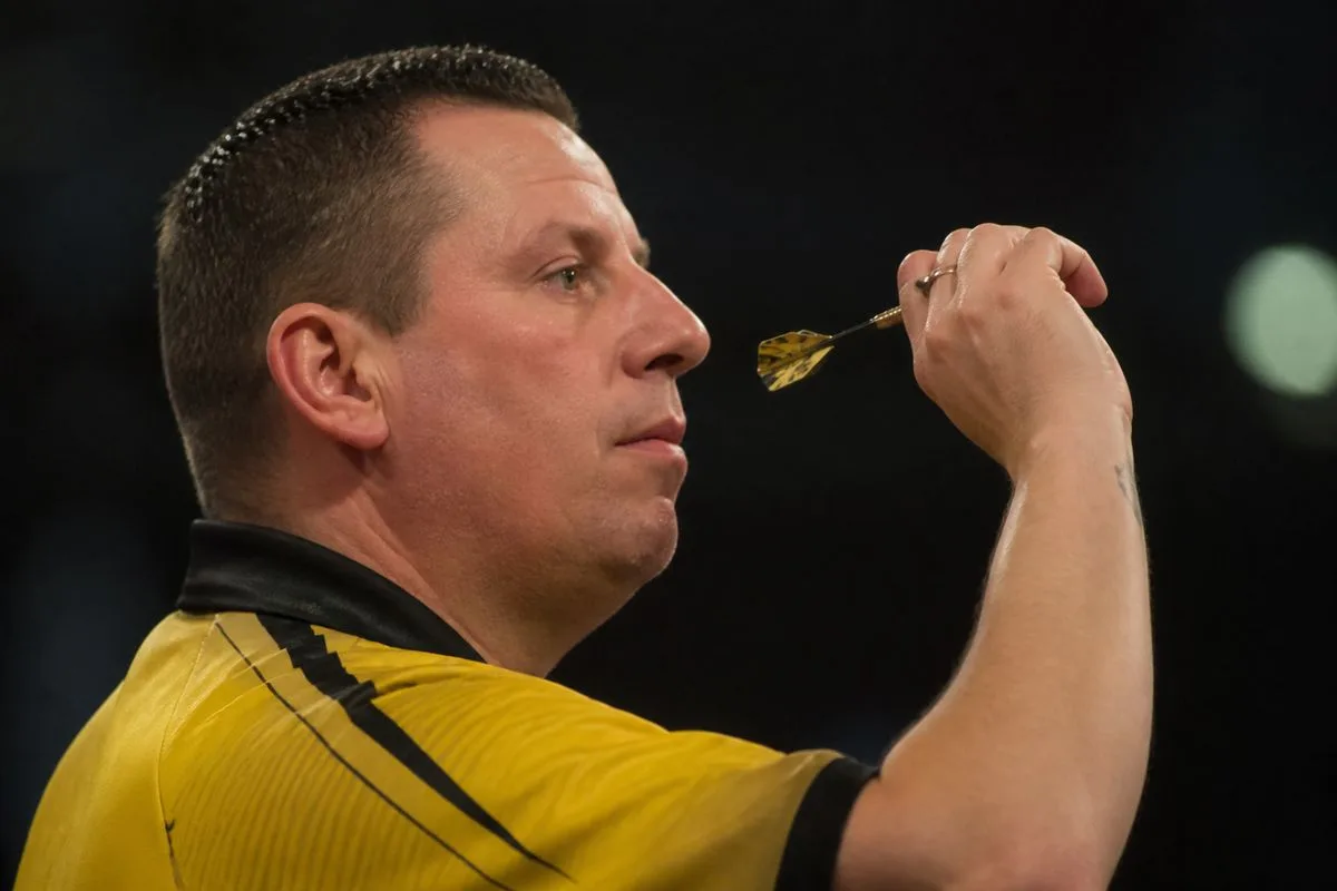 Dave Chisnall concentrating during a darts match.