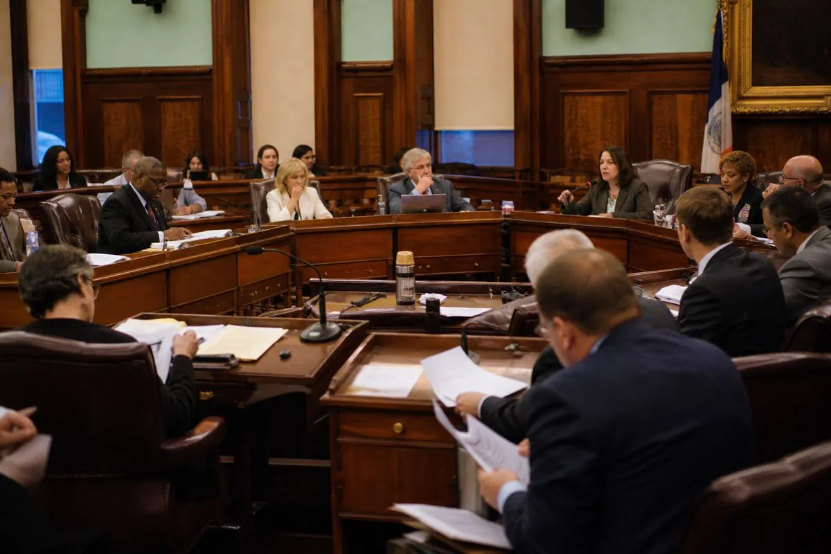 City council meeting discussing budget reforms