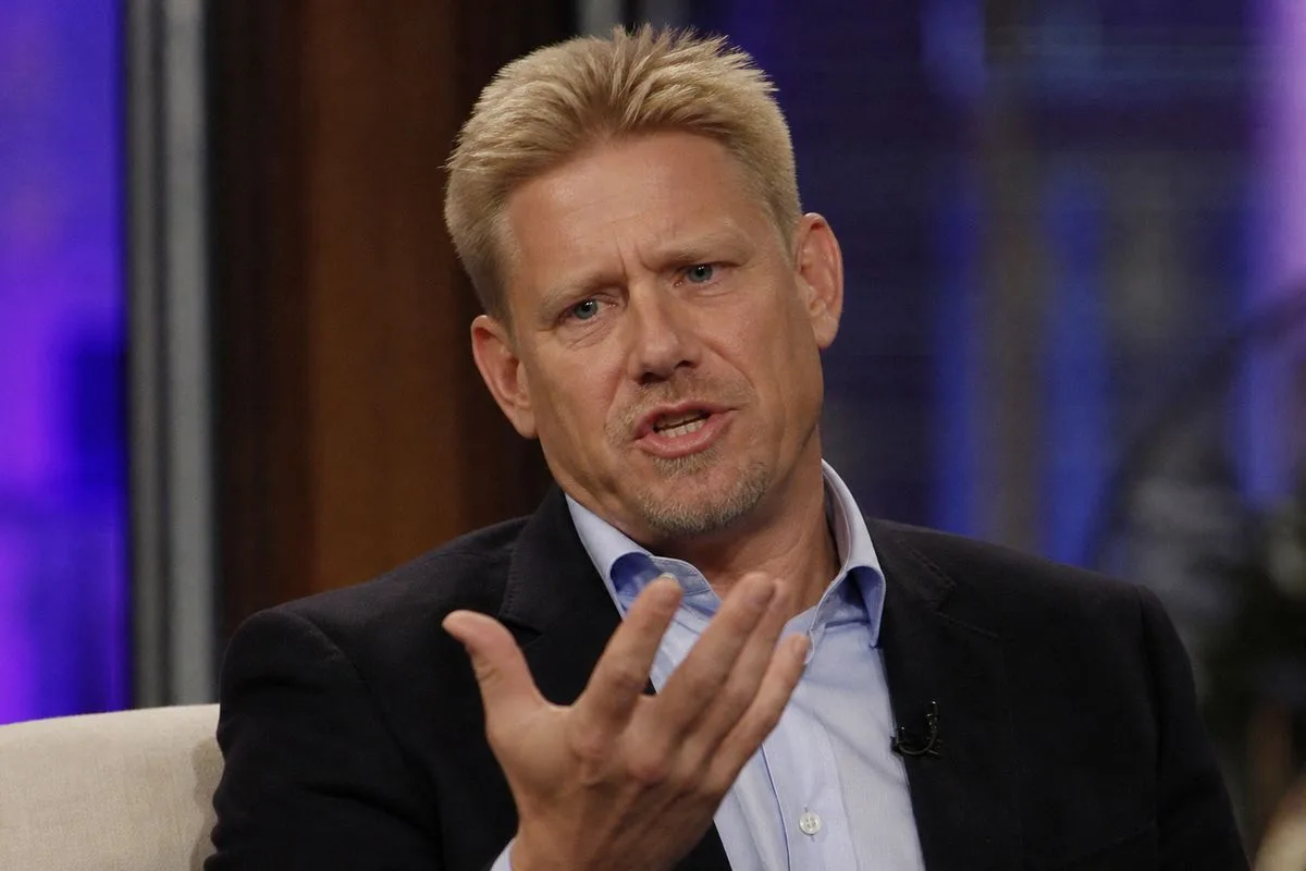 Peter Schmeichel speaking passionately in a TV studio.