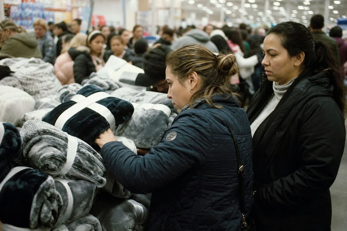 Shoppers examining bundled products in a crowded store aisle