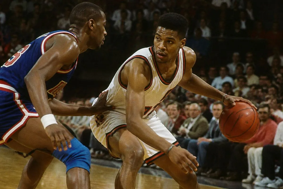 Jerome dribbling the basketball under defensive pressure.
