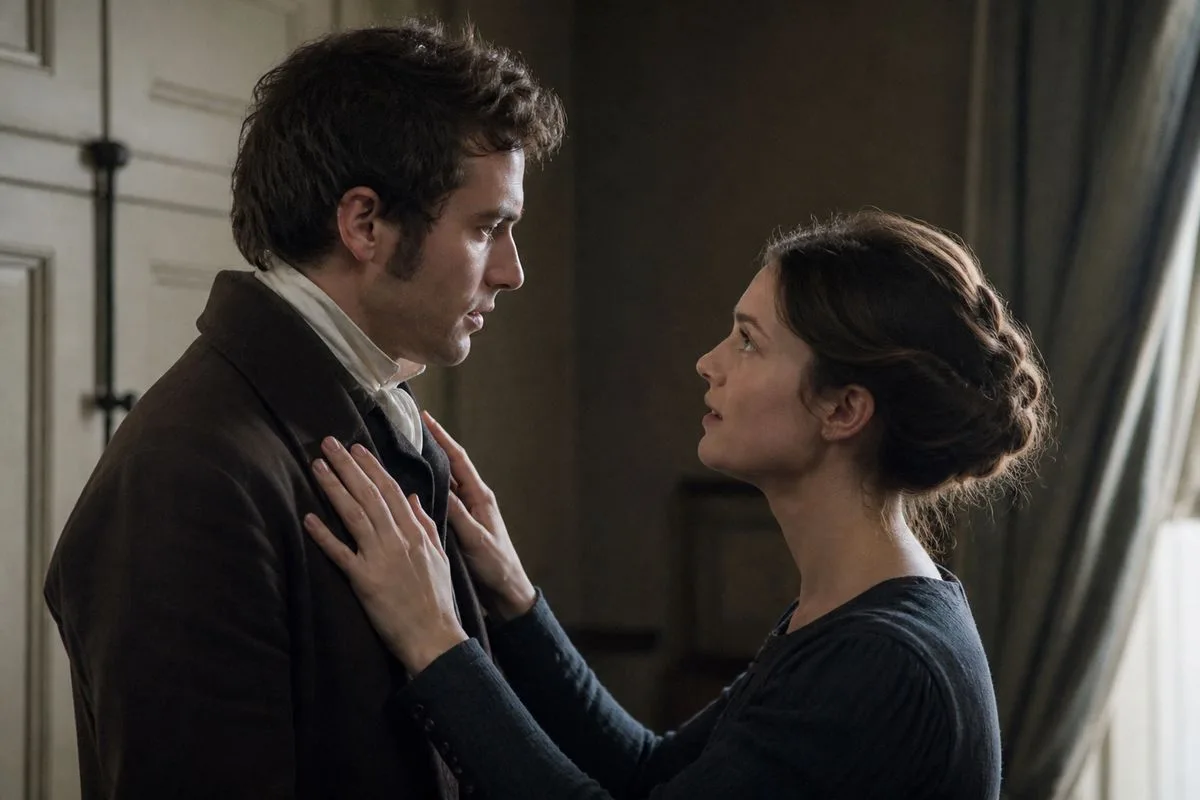 Actors rehearsing a heartfelt scene on a period drama set