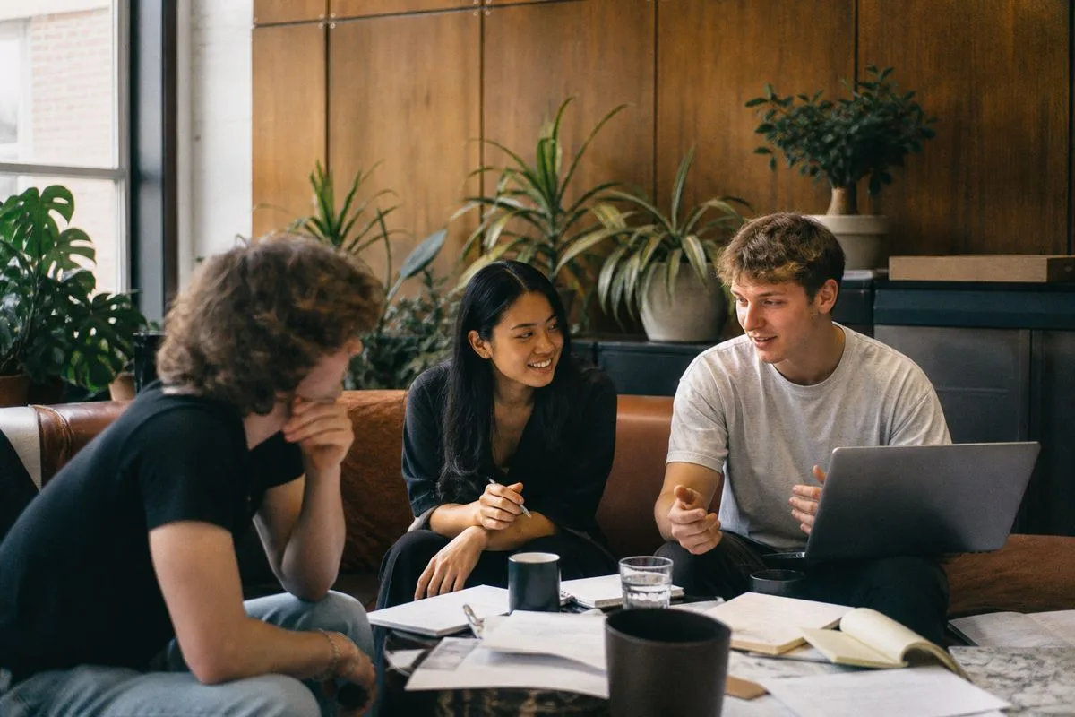 College students collaborating on a startup project in a campus lounge