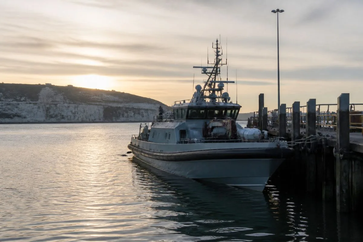 Border Force vessel docking at Dover port at dawn