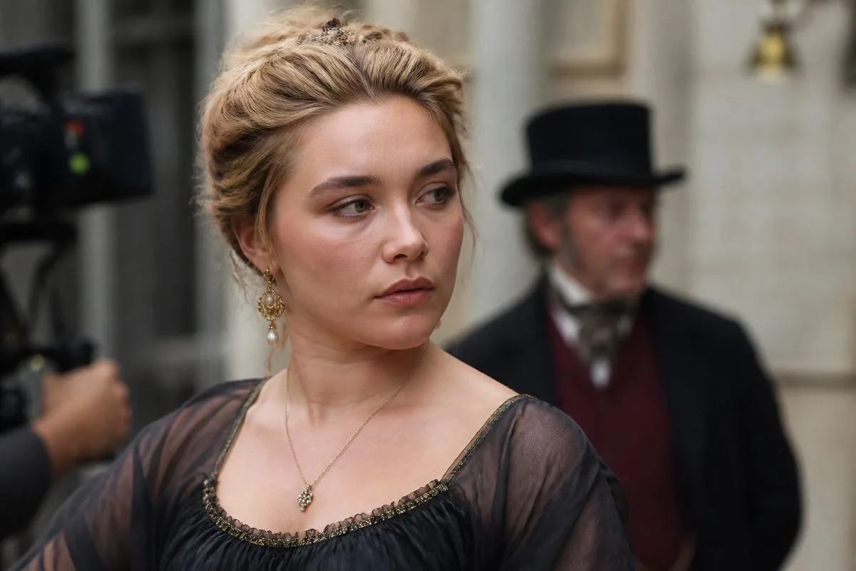 Florence Pugh on set filming a period miniseries scene