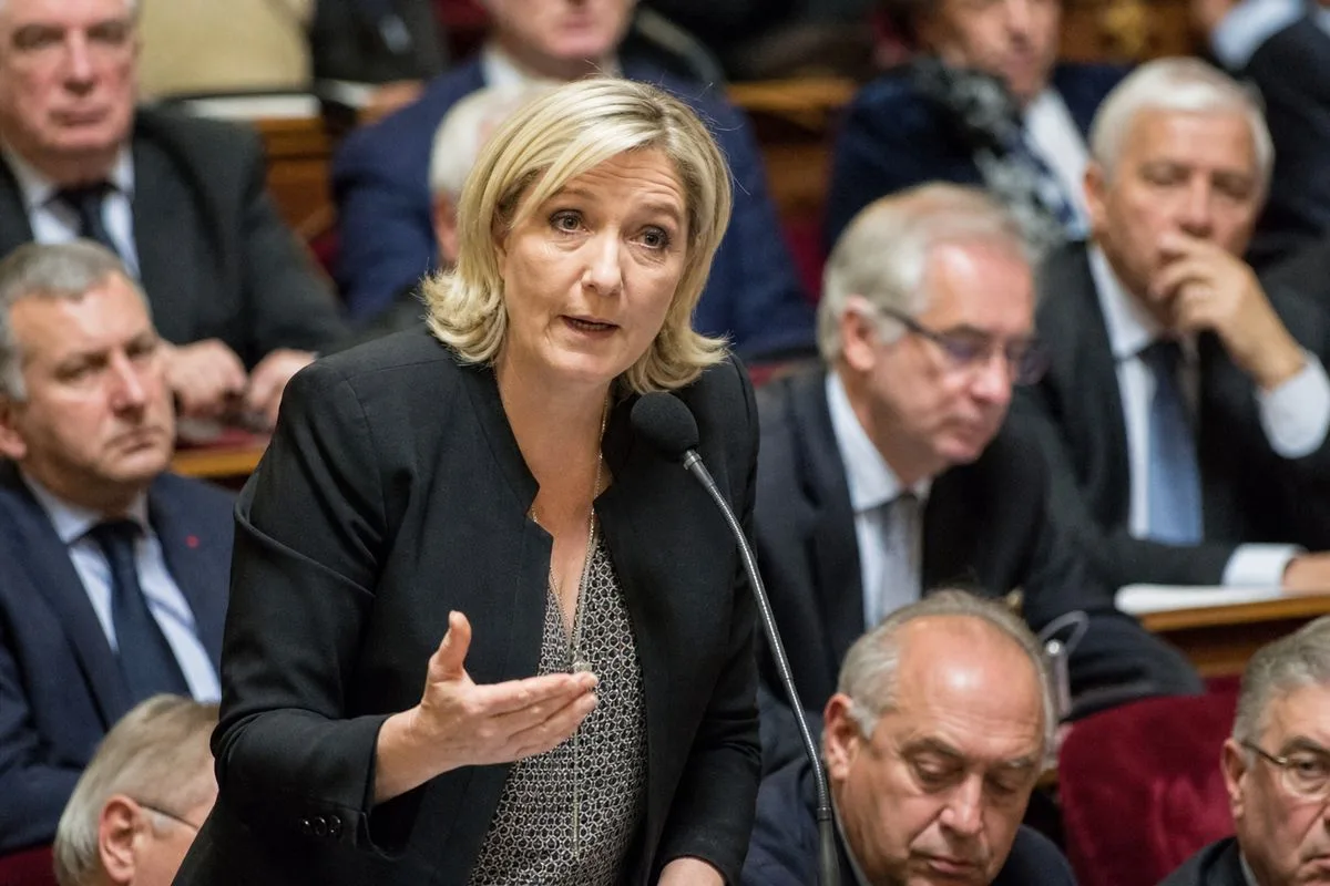 Marine Le Pen speaking at a crowded French Senate session