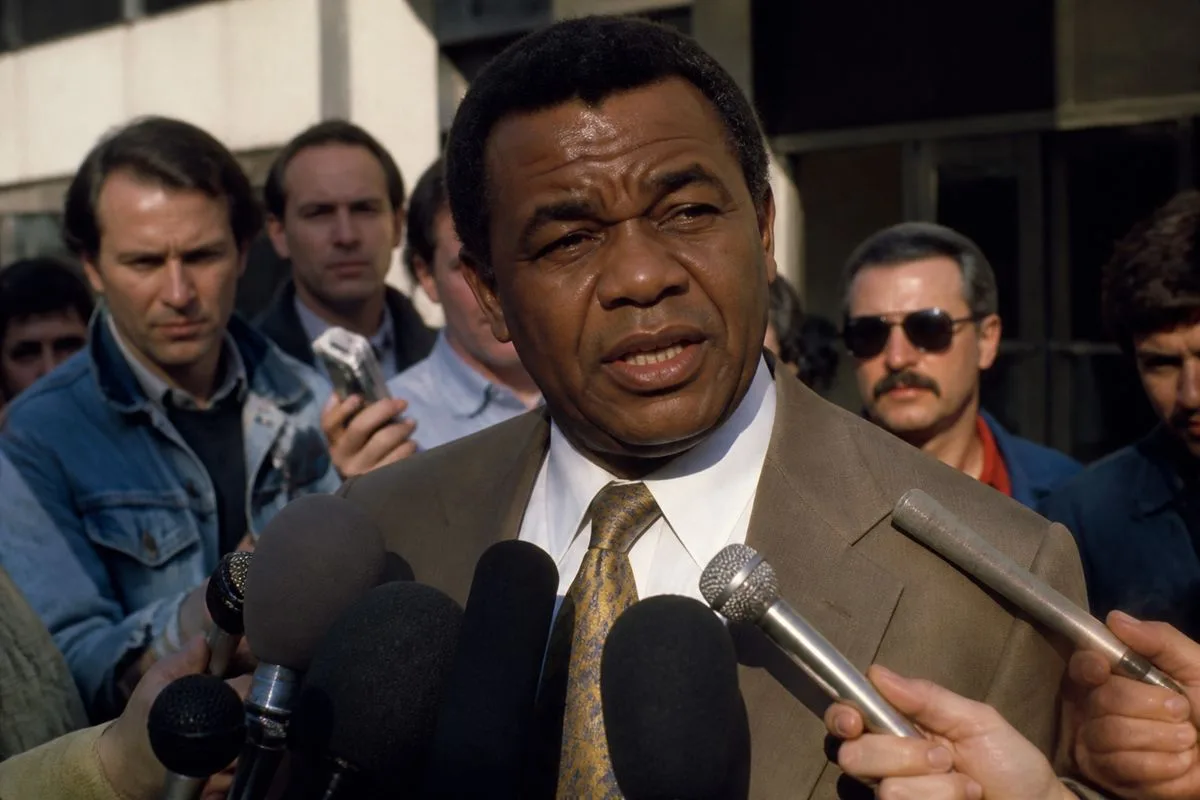 Coach Jones speaking to reporters outside a television studio