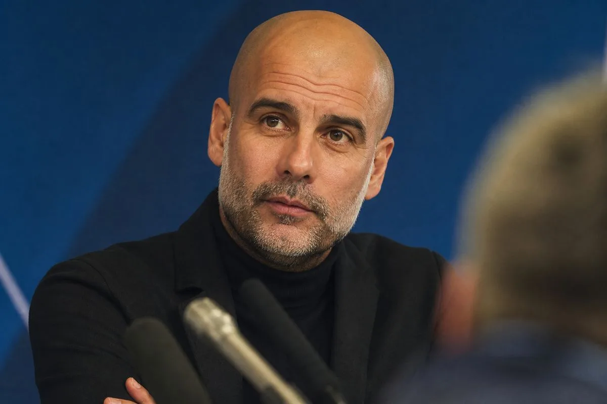 Manchester City manager addressing reporters at a press conference.