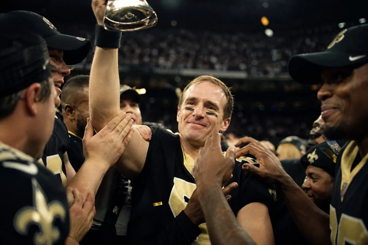 Drew Brees celebrating with the Saints after a championship win